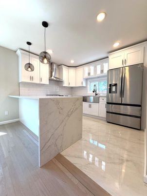Interior, Kitchen, Marble, Marble Walls, Pendant Lights, Recessed Lighting, Stainless Steel Appliances, Wood Texture Flooring