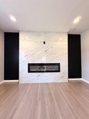 Fireplace, Interior, Marble Walls, Recessed Lighting, Wood Texture Flooring