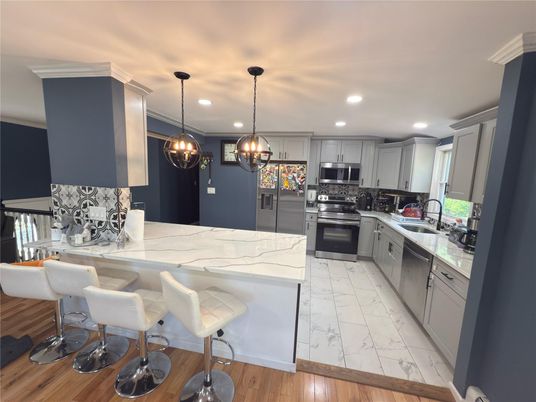 Interior, Kitchen, Marble, Pendant Lights, Recessed Lighting, Stainless Steel Appliances, Wood Texture Flooring