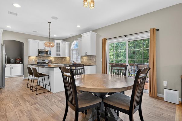 Chandelier, Dining room, Interior, Kitchen, Pendant Lights, Recessed Lighting, Stainless Steel Appliances, Wood Texture Flooring