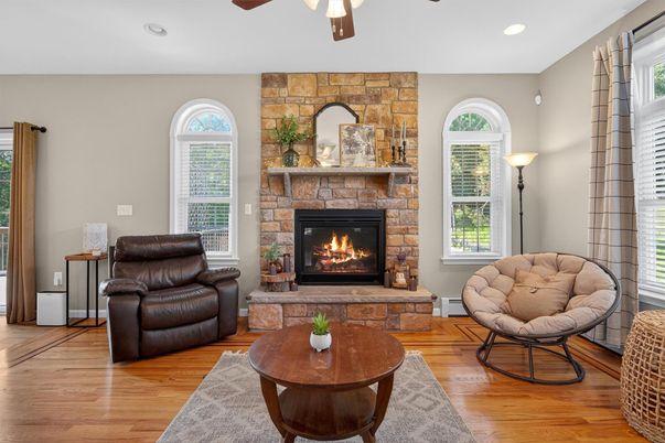 Fireplace, Interior, Living room, Recessed Lighting, Stone Walls, Wood Texture Flooring