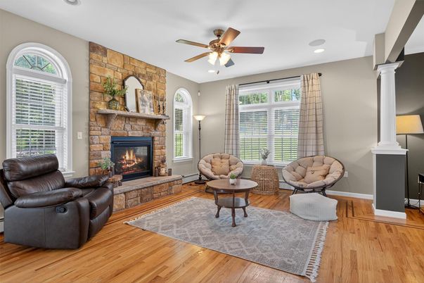 Fireplace, Interior, Living room, Recessed Lighting, Stone Walls, Wood Texture Flooring