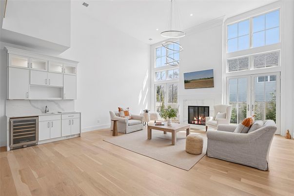 Fireplace, Interior, Living room, Marble Walls, Pendant Lights, Recessed Lighting, Wood Texture Flooring