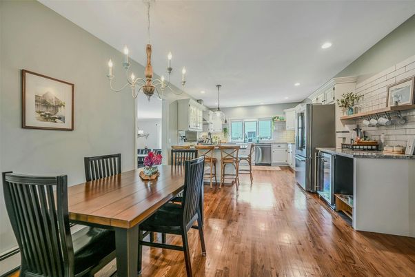 Chandelier, Dining room, Interior, Kitchen, Pendant Lights, Recessed Lighting, Stainless Steel Appliances, Wood Texture Flooring