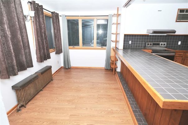 Interior, Kitchen, Tile Countertops, Wood Texture Flooring