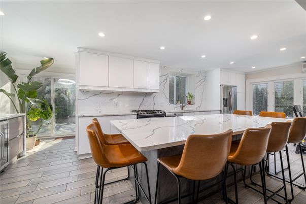 Interior, Kitchen, Marble Walls, Recessed Lighting, Stainless Steel Appliances, Wood Texture Flooring