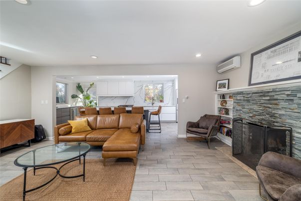 Fireplace, Interior, Living room, Marble Walls, Recessed Lighting, Wood Texture Flooring