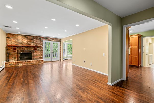 Empty room, Fireplace, Interior, Recessed Lighting, Stone Walls, Wood Texture Flooring
