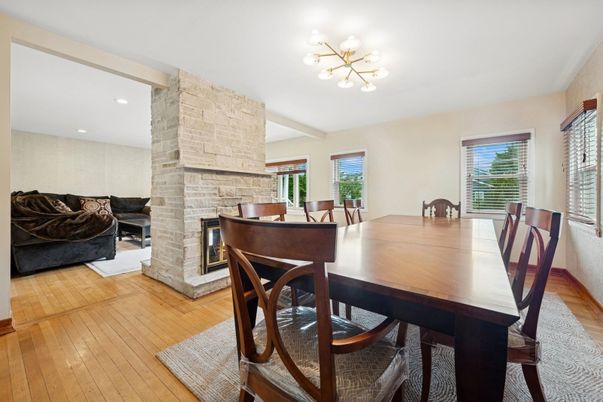 Dining room, Fireplace, Interior, Recessed Lighting, Stone Walls, Wood Texture Flooring