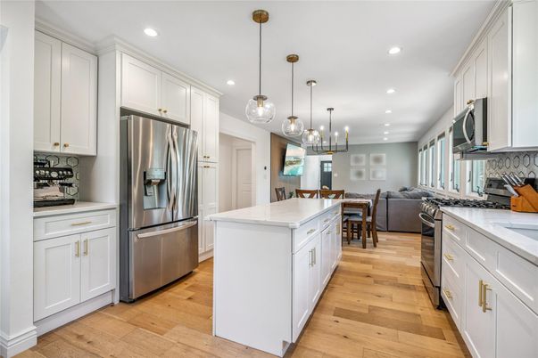 Dining room, Interior, Kitchen, Living room, Pendant Lights, Recessed Lighting, Stainless Steel Appliances, Wood Texture Flooring