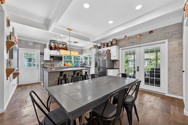Dining room, Interior, Kitchen, Pendant Lights, Recessed Lighting, Stainless Steel Appliances, Wood Texture Flooring