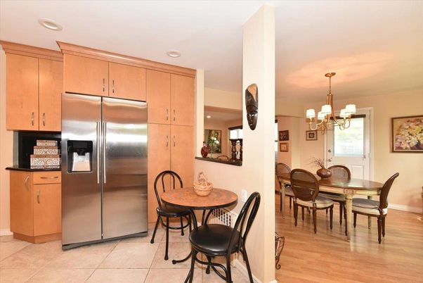 Chandelier, Dining room, Interior, Kitchen, Recessed Lighting, Stainless Steel Appliances, Wood Texture Flooring