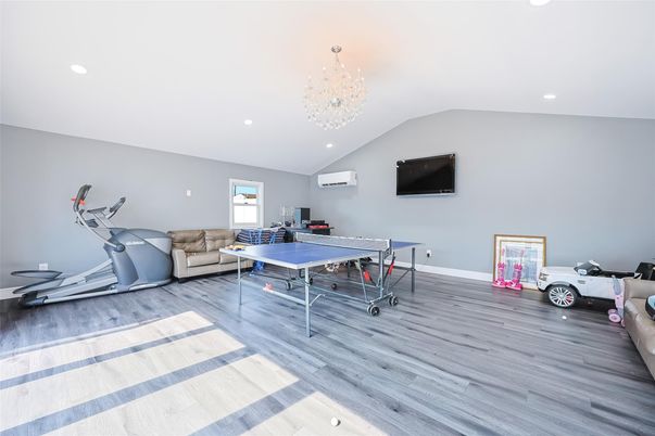 Chandelier, Fitness Equipment, Game Room, Interior, Recessed Lighting, Wood Texture Flooring