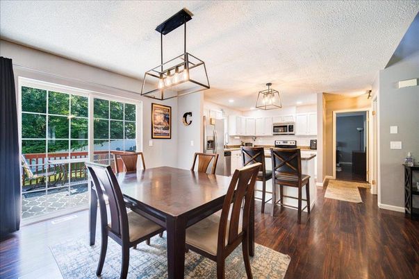 Dining room, Interior, Kitchen, Pendant Lights, Recessed Lighting, Stainless Steel Appliances, Wood Texture Flooring