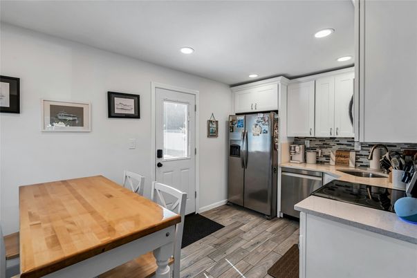 Dining room, Interior, Kitchen, Recessed Lighting, Stainless Steel Appliances, Wood Texture Flooring
