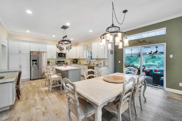 Dining room, Interior, Kitchen, Pendant Lights, Recessed Lighting, Stainless Steel Appliances, Wood Texture Flooring