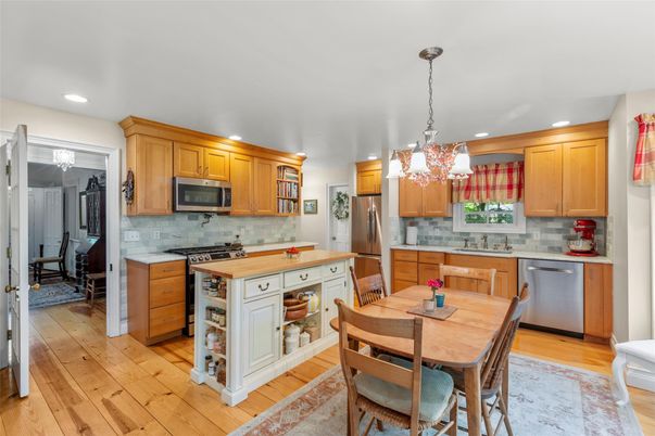 Chandelier, Dining room, Interior, Kitchen, Pendant Lights, Recessed Lighting, Stainless Steel Appliances, Wood Texture Flooring