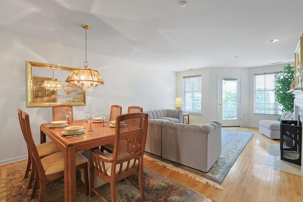 Dining room, Fireplace, Interior, Living room, Pendant Lights, Recessed Lighting, Wood Texture Flooring