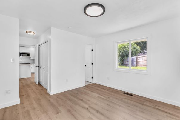 Empty room, Interior, Kitchen, Stainless Steel Appliances, Wood Texture Flooring