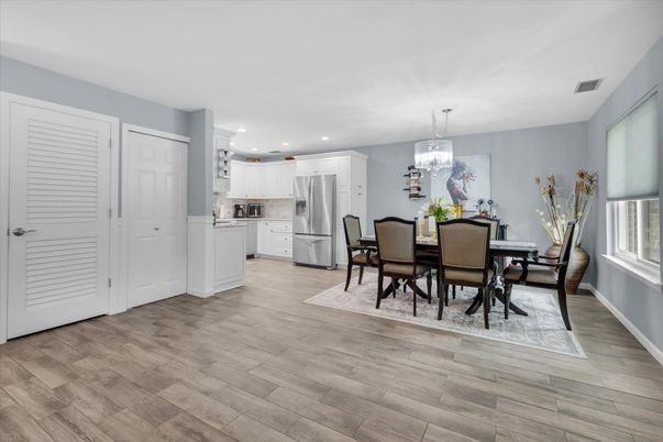 Dining room, Interior, Kitchen, Pendant Lights, Recessed Lighting, Stainless Steel Appliances, Wood Texture Flooring