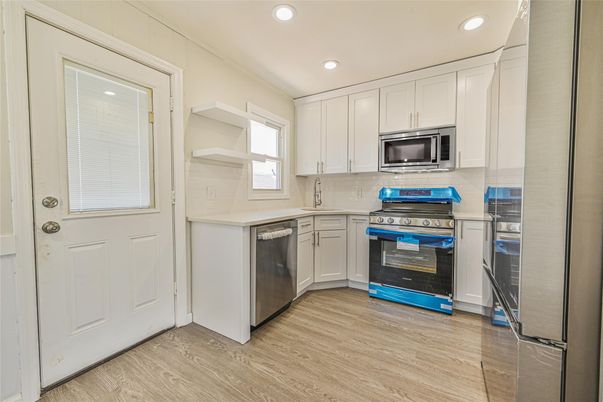 Interior, Kitchen, Recessed Lighting, Stainless Steel Appliances, Wood Texture Flooring