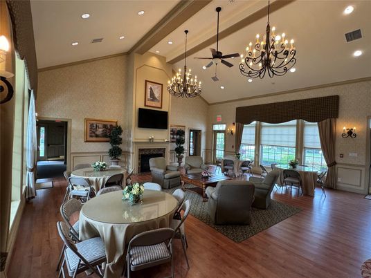Chandelier, Dining room, Fireplace, Interior, Living room, Pendant Lights, Recessed Lighting, Wood Texture Flooring