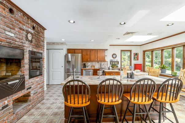 Fireplace, Interior, Kitchen, Recessed Lighting, Stainless Steel Appliances, Stone Walls