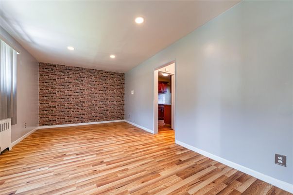 Empty room, Interior, Recessed Lighting, Stone Walls, Wood Texture Flooring