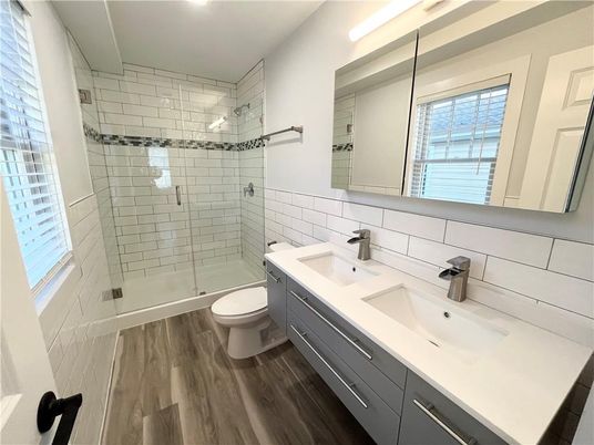 Bathroom, Dual Sink Vanities, Glass Shower, Interior, Wood Texture Flooring