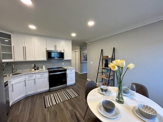 Dining room, Interior, Kitchen, Recessed Lighting, Stainless Steel Appliances, Wood Texture Flooring