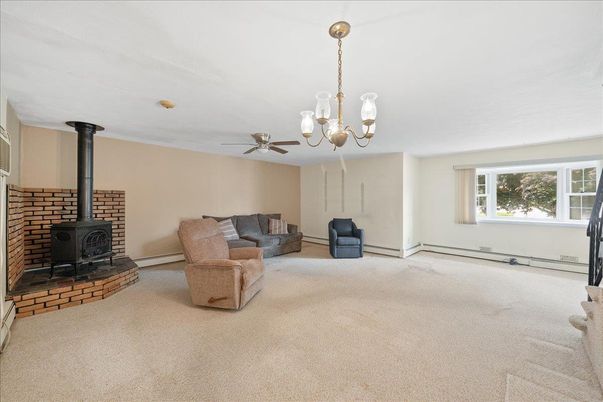 Chandelier, Fireplace, Interior, Living room, Stone Walls