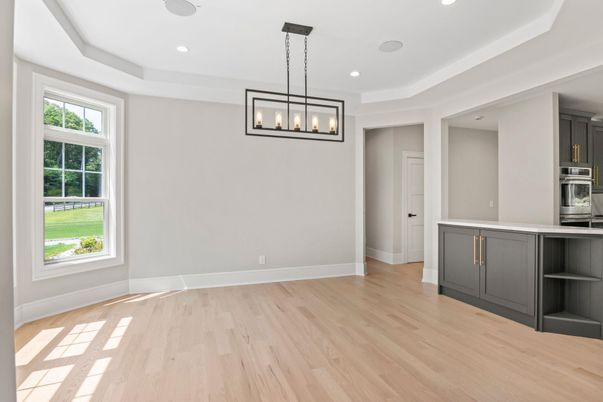 Empty room, Interior, Kitchen, Pendant Lights, Recessed Lighting, Stainless Steel Appliances, Wood Texture Flooring