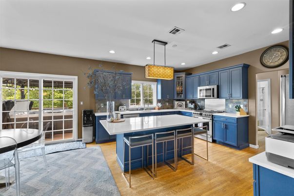 Chandelier, Interior, Kitchen, Pendant Lights, Recessed Lighting, Stainless Steel Appliances, Wood Texture Flooring