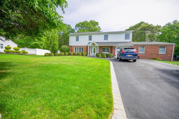 Backyard, Exterior, Facade, Brick Facade, Raised Ranch