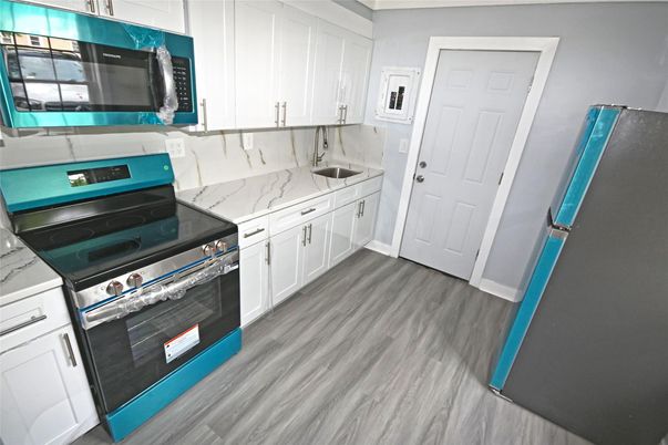 Interior, Kitchen, Marble Walls, Stainless Steel Appliances, Wood Texture Flooring