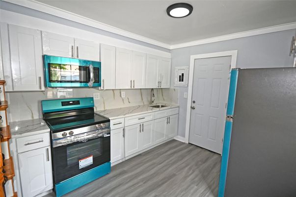 Interior, Kitchen, Marble Walls, Stainless Steel Appliances, Wood Texture Flooring
