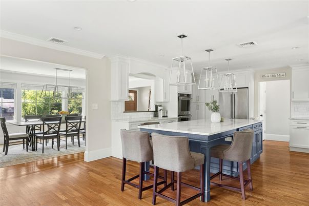 Dining room, Interior, Kitchen, Pendant Lights, Recessed Lighting, Stainless Steel Appliances, Wood Texture Flooring