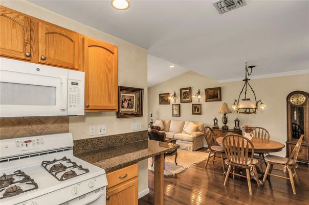 Chandelier, Dining room, Interior, Kitchen, Living room, Recessed Lighting, Wood Texture Flooring