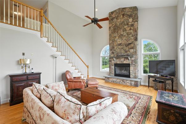 Fireplace, Interior, Living room, Recessed Lighting, Stone Walls, Wood Texture Flooring