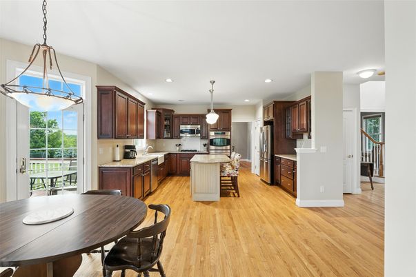 Dining room, Interior, Kitchen, Pendant Lights, Recessed Lighting, Stainless Steel Appliances, Wood Texture Flooring
