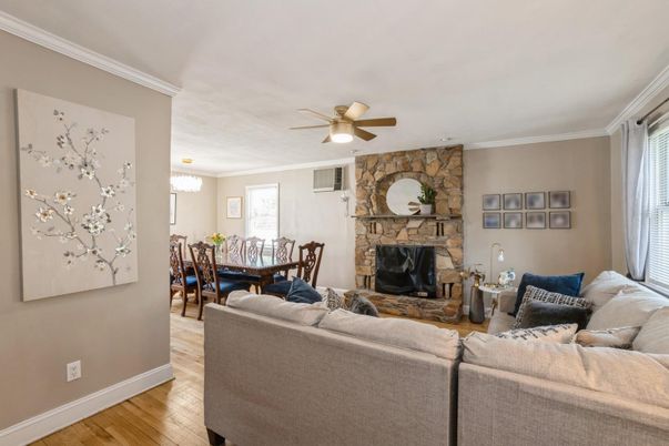 Chandelier, Dining room, Fireplace, Interior, Living room, Stone Walls, Wood Texture Flooring