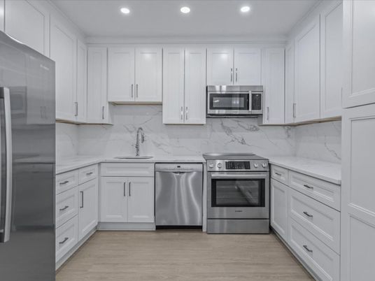Interior, Kitchen, Marble Walls, Recessed Lighting, Stainless Steel Appliances, Wood Texture Flooring