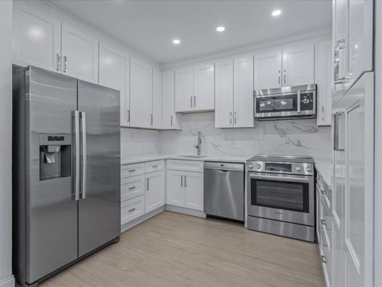 Interior, Kitchen, Marble Walls, Recessed Lighting, Stainless Steel Appliances, Wood Texture Flooring