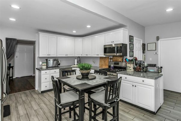 Dining room, Interior, Kitchen, Recessed Lighting, Stainless Steel Appliances, Wood Texture Flooring