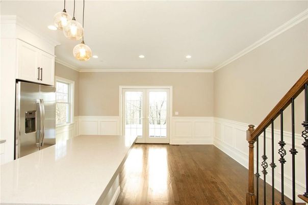 Empty room, Interior, Kitchen, Pendant Lights, Recessed Lighting, Stainless Steel Appliances, Wood Texture Flooring