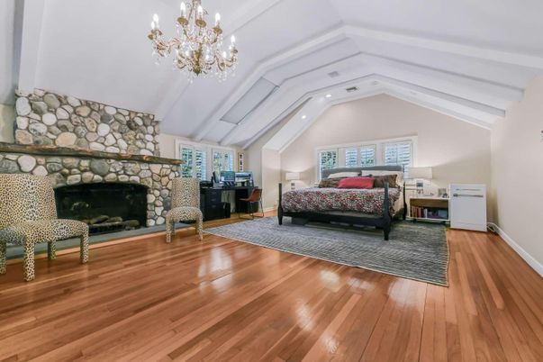 Bedroom, Chandelier, Fireplace, Interior, Recessed Lighting, Wood Texture Flooring
