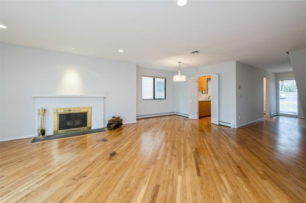 Empty room, Fireplace, Interior, Pendant Lights, Recessed Lighting, Wood Texture Flooring