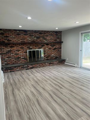 Empty room, Fireplace, Interior, Recessed Lighting, Stone Walls, Wood Texture Flooring
