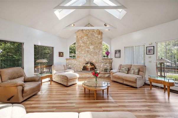 Fireplace, Interior, Living room, Recessed Lighting, Stone Walls, Wood Texture Flooring