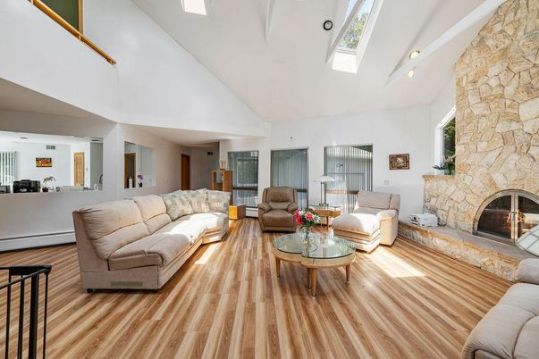 Fireplace, Interior, Living room, Recessed Lighting, Stone Walls, Wood Texture Flooring